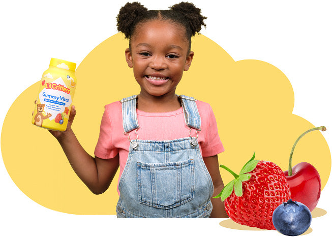 Child holding L’il Critters gummy vitamins